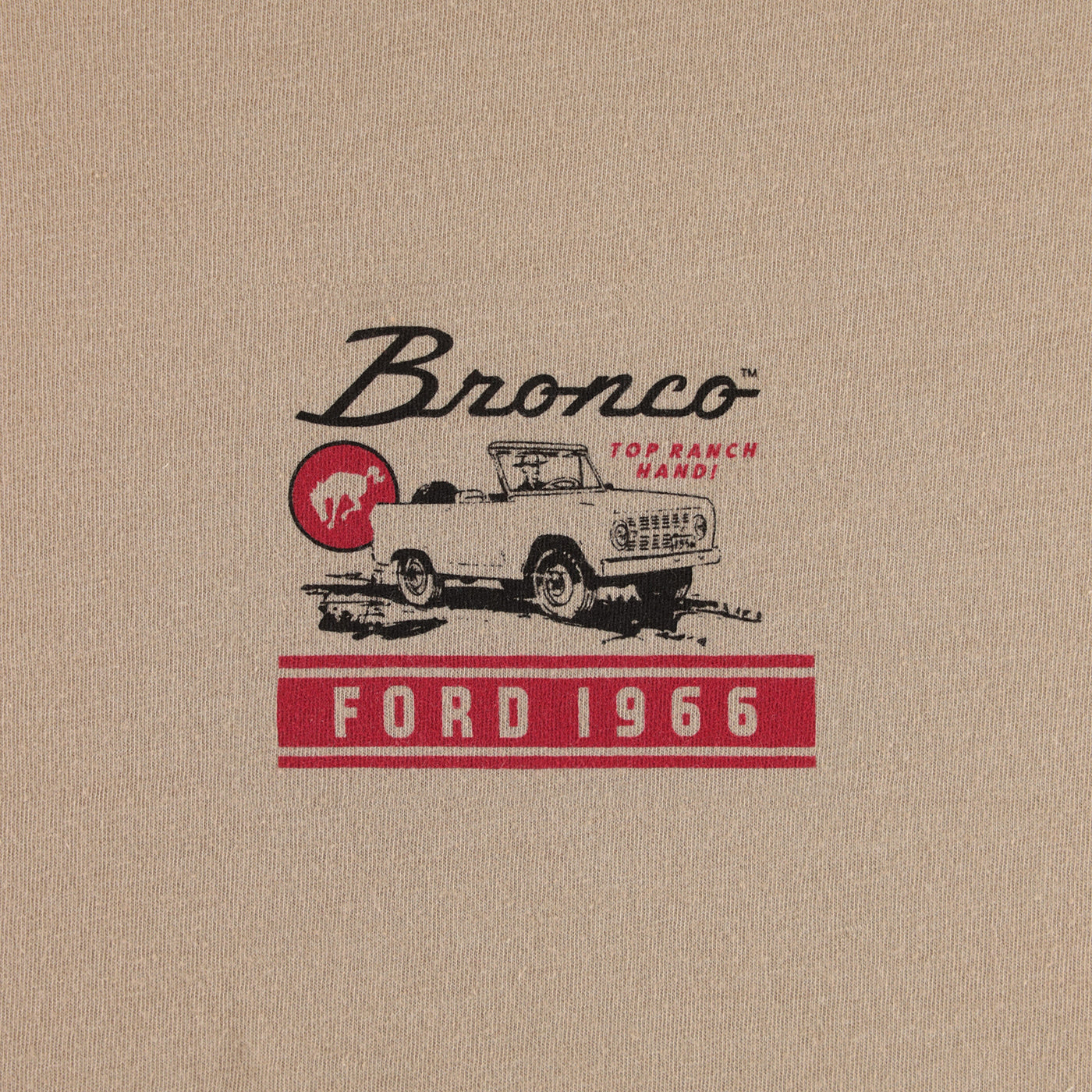 Vintage Ford Bronco logo on beige fabric background