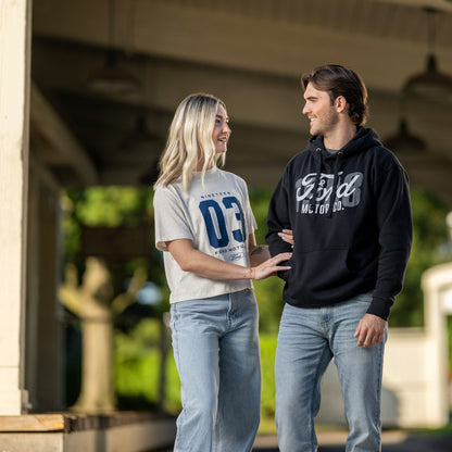 man and women outside wearing ford motor co hoodies and t-shirts in jeans