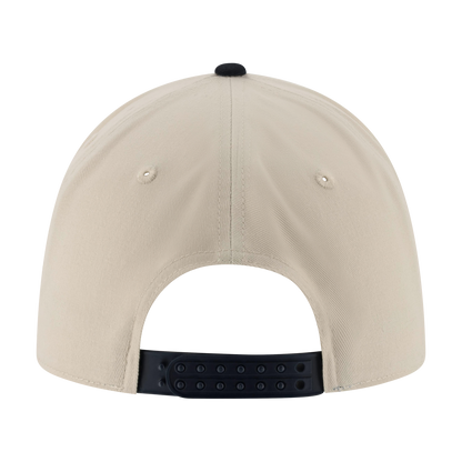 back of a beige hat with a navy blue snapback closure
