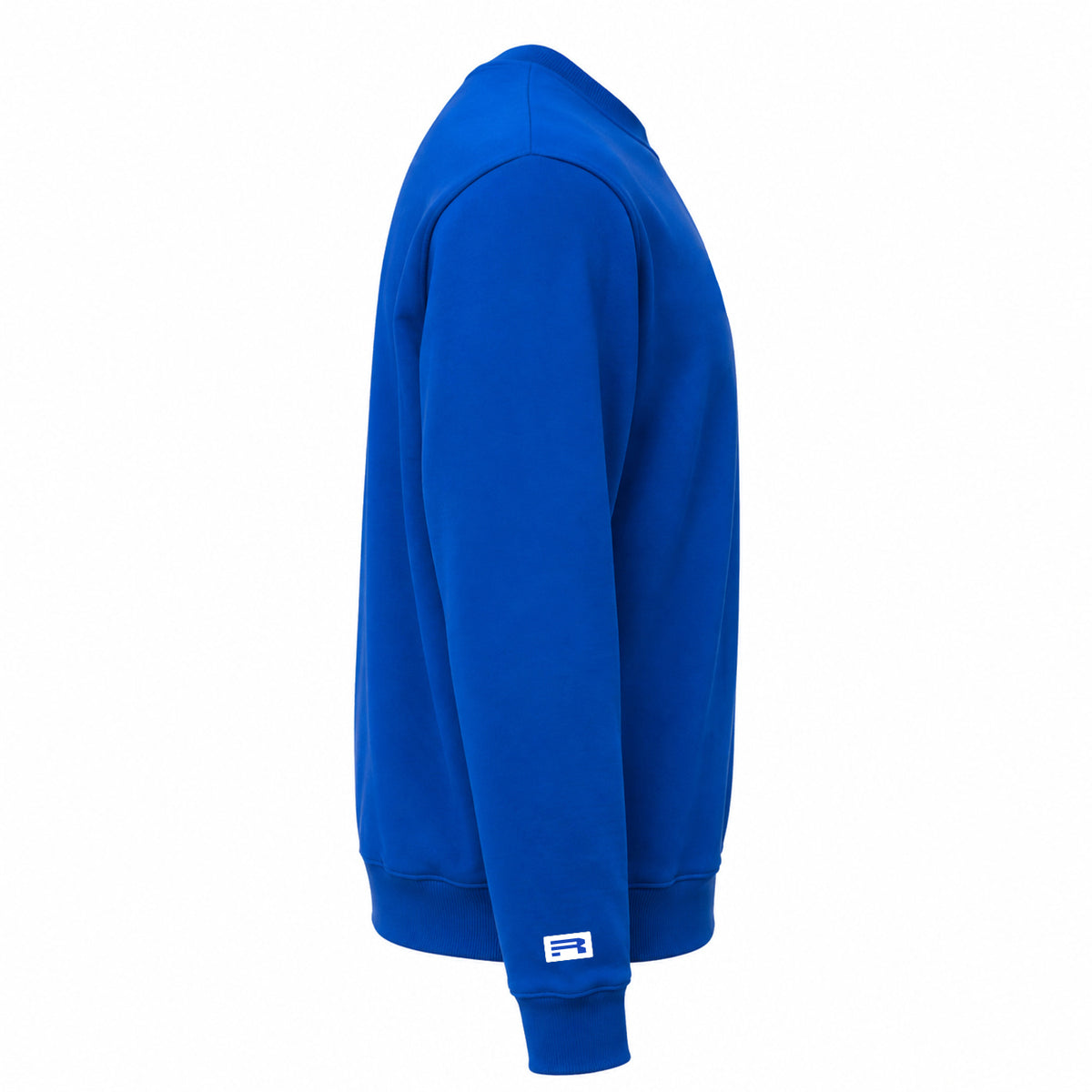 A side profile view of a royal blue crewneck sweatshirt on a solid white background, featuring a small white and blue logo patch on the cuff.