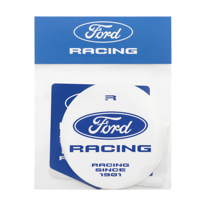 A white oval Ford Racing sticker with blue lettering, shown inside a clear plastic sleeve with blue header packaging. The packaging features the Ford Racing logo at the top.