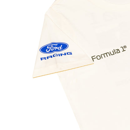 Close-up of a white Ford Racing t-shirt sleeve featuring the blue oval Ford logo and 'RACING' text, with 'Formula 1' printed in dark green on the adjacent side.
