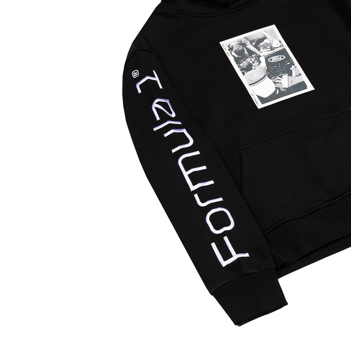 A close-up of a black hoodie featuring large white vertical 'FORTMOUTH' text printed down one sleeve and a black-and-white graphic patch on the left chest, shown on a plain white background.