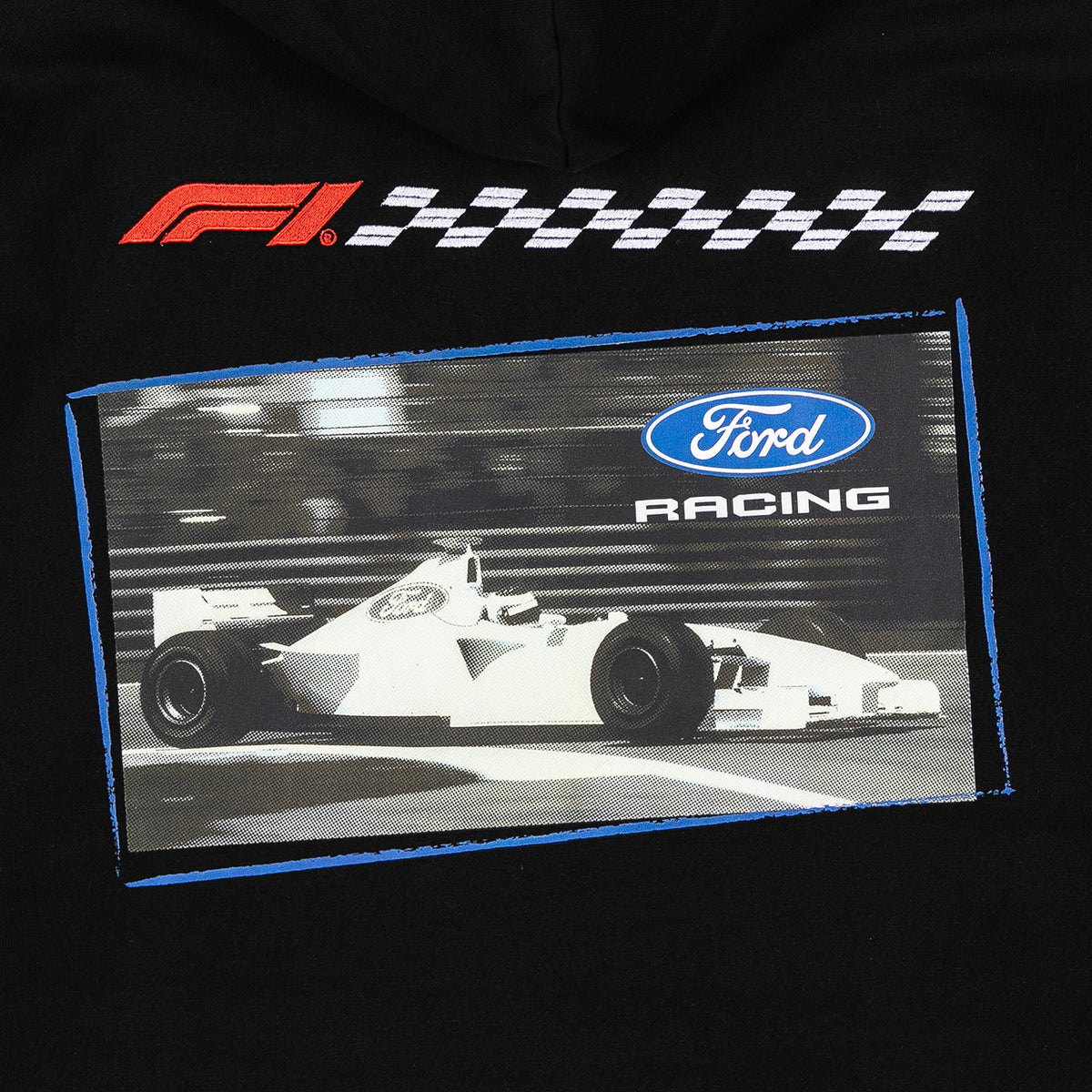 A close-up of a black garment featuring a large graphic print. The print includes a red and white F1 checkered logo at the top, a blue-bordered rectangular image of a white Formula 1 car with a blue Ford Racing logo, and a black background.
