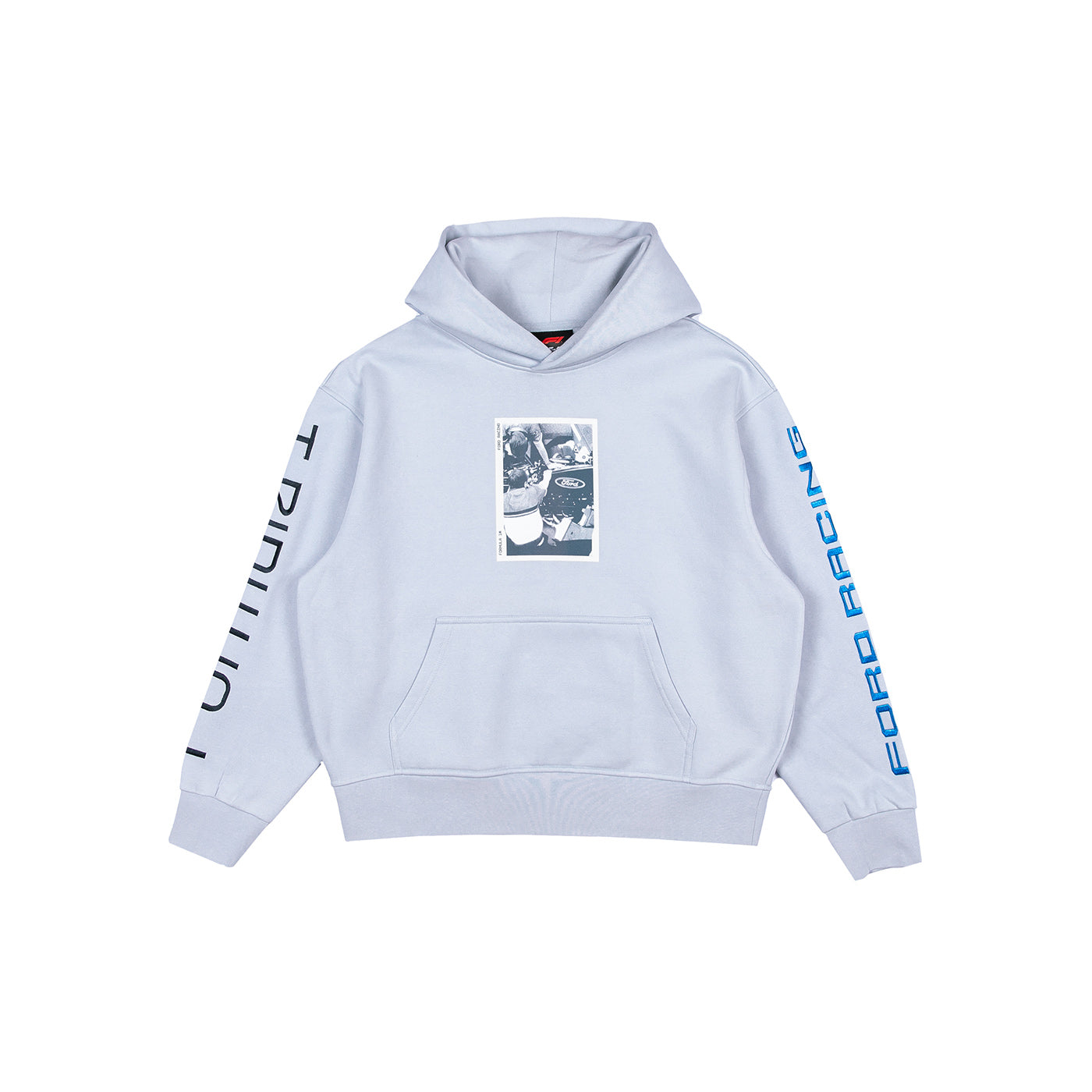 A light blue pullover hoodie with a front kangaroo pocket, featuring a black-and-white graphic print on the chest and vertical text printed in black on one sleeve and blue on the other sleeve, displayed on a solid white background.