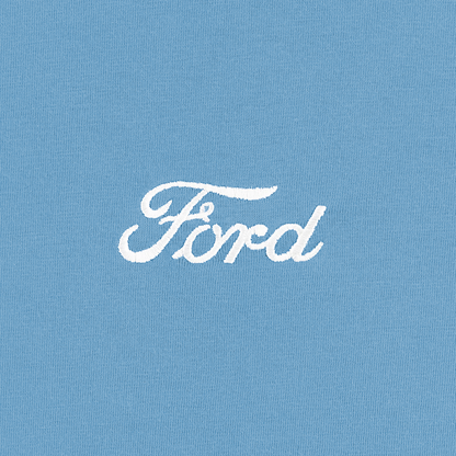 close up of white Ford script on a blue t-shirt