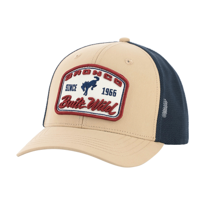 Beige and navy cap with a brand patch on a white background