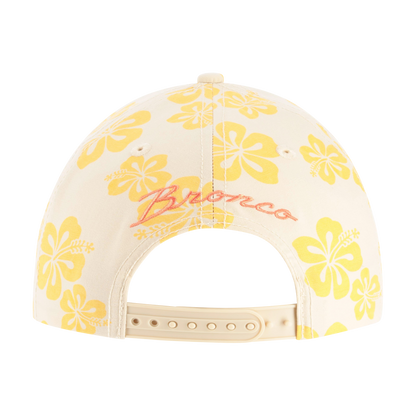 Cap with yellow floral patterns and 'Bronco' branding on a white background