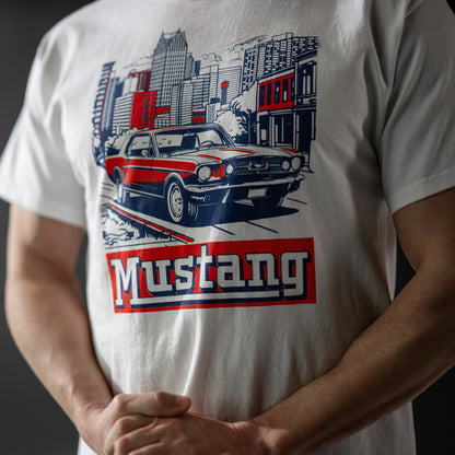 White t-shirt with a graphic of a red and blue car and 'Mustang' text on a dark background