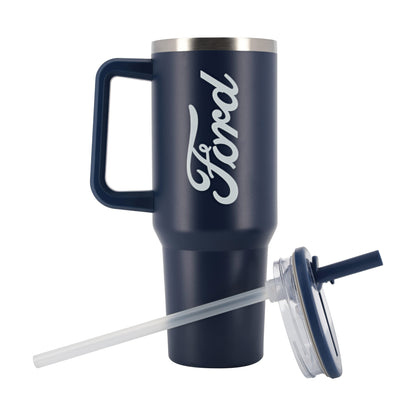 A navy blue insulated travel tumbler with a handle, featuring a white Ford logo printed on the side. The tumbler is shown with its clear lid and clear straw accessory on a plain white background.