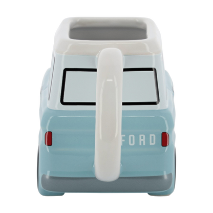 back of a light blue vintage Bronco shaped ceramic car mug on a white background