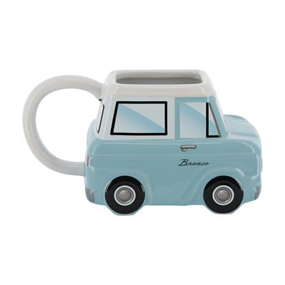 light blue vintage Bronco shaped ceramic car mug on a white background