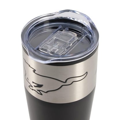 Close-up of a stainless steel tumbler with a clear lid and a black body, featuring a black outline graphic of a running horse.