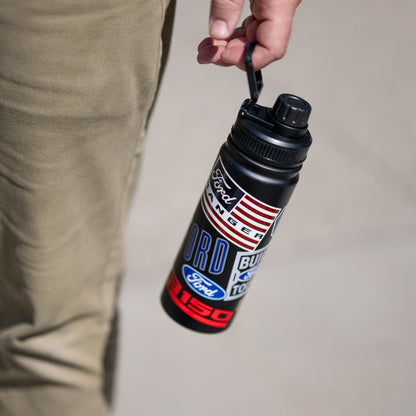 man holding a black Ford Trucks water bottle with patches on a cream background