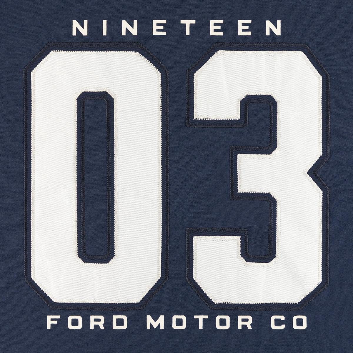 a varsity styled navy blue Ford crewneck with nineteen 03 ford motor co text in white