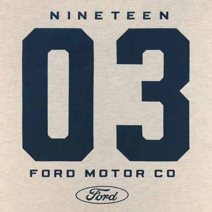 A close-up of a light beige fabric surface printed with large navy blue numbers '03', the word 'NINETEEN' above, and 'FORD MOTOR CO' with a Ford oval logo below.