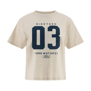 A light beige heathered t-shirt featuring a navy blue graphic print on the front with the text 'NINETEEN 03 FORD MOTOR CO' and the Ford logo.