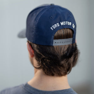 man wearing a navyblue ford motorco snapback hat