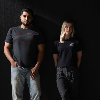 man and a woman in black Mustang t-shirts standing against a black background