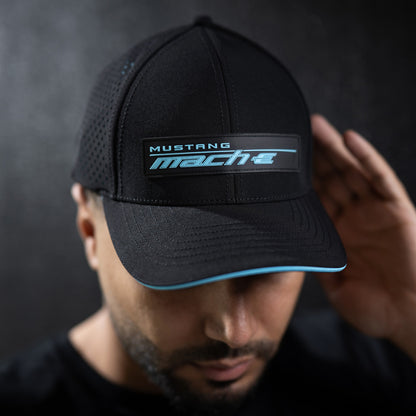 man wearing a Mustang mach-e hat and t-shirt on a black background