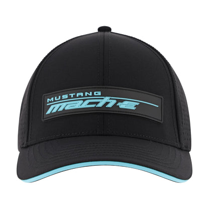 A black trucker-style baseball cap featuring a rectangular front patch with the text 'MUSTANG mach-e' in light blue and white, with a matching light blue accent line along the brim's edge, shown against a plain white background.