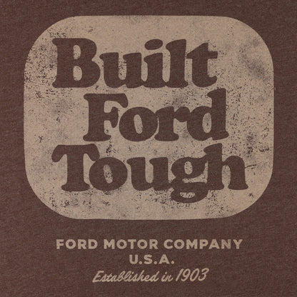 A vintage-style graphic print featuring the words 'Built Ford Tough' in large dark brown lettering inside a rounded beige square, with 'FORD MOTOR COMPANY U.S.