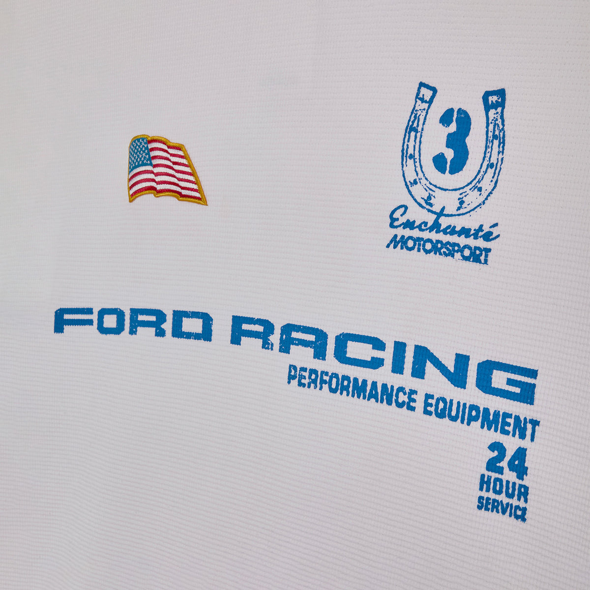 close up of enchante and Ford Racing logos on a white background