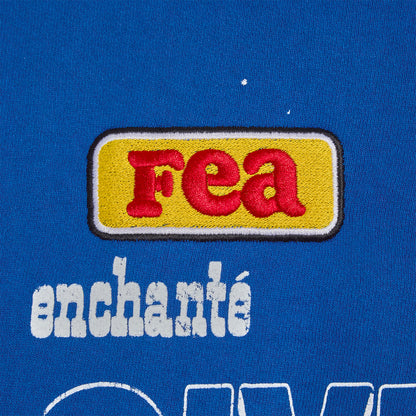 FEA yellow patch with enchante text on a blue background