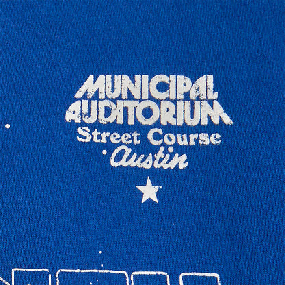 Municipal auditorium street course graphic text on a ford racing blue background 