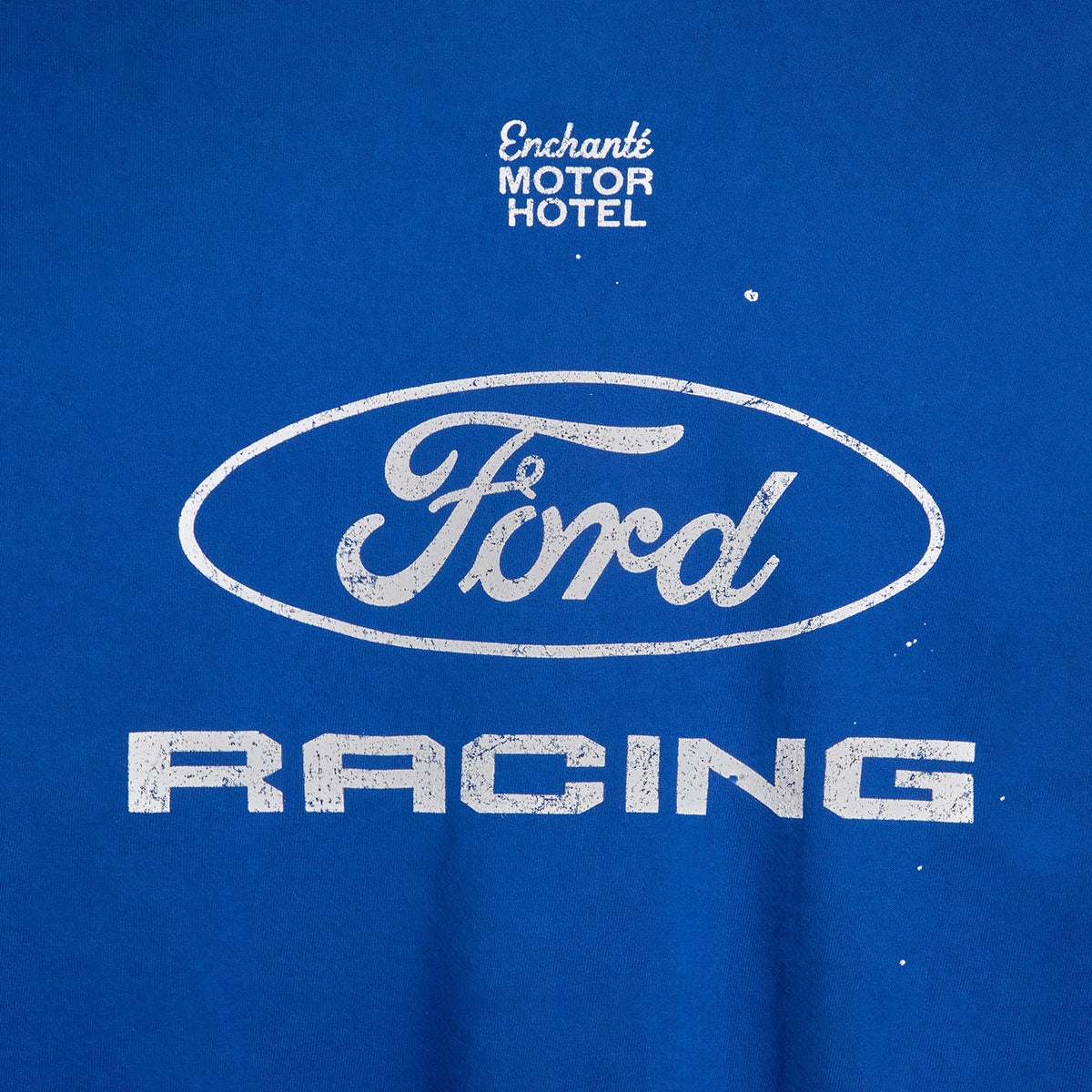 back of a Ford Racing blue crewneck with enchante motor hotel text on a white background