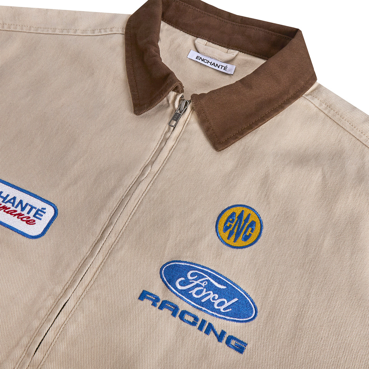 close up of a canvas ford racing jacket with patches and an brown accent collar