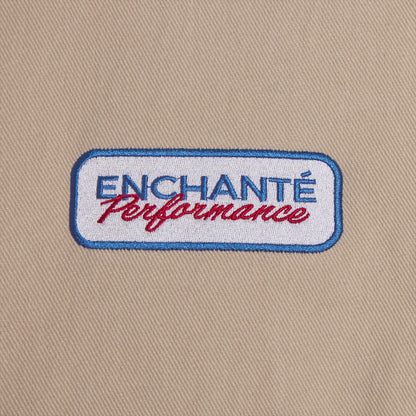 close up of an Enchante performance patch on a tann background