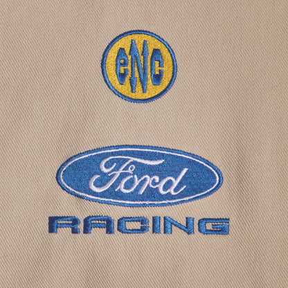close up of ENC and Ford Racing patches on a tann background