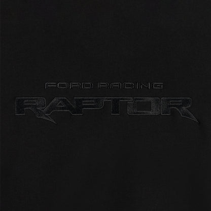close up of embroidered Ford Racing Raptor text on a black background