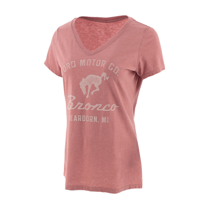 Pink t-shirt with white graphic and text on a white background