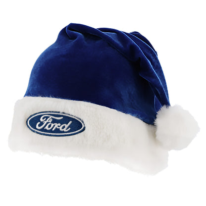 A blue and white holiday hat with the Ford oval logo on the front cuff, featuring a fluffy white trim.