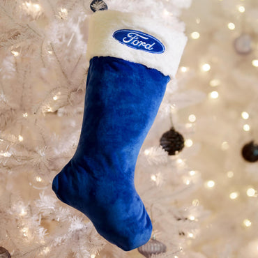 Blue Christmas stocking with Ford logo on a decorated tree