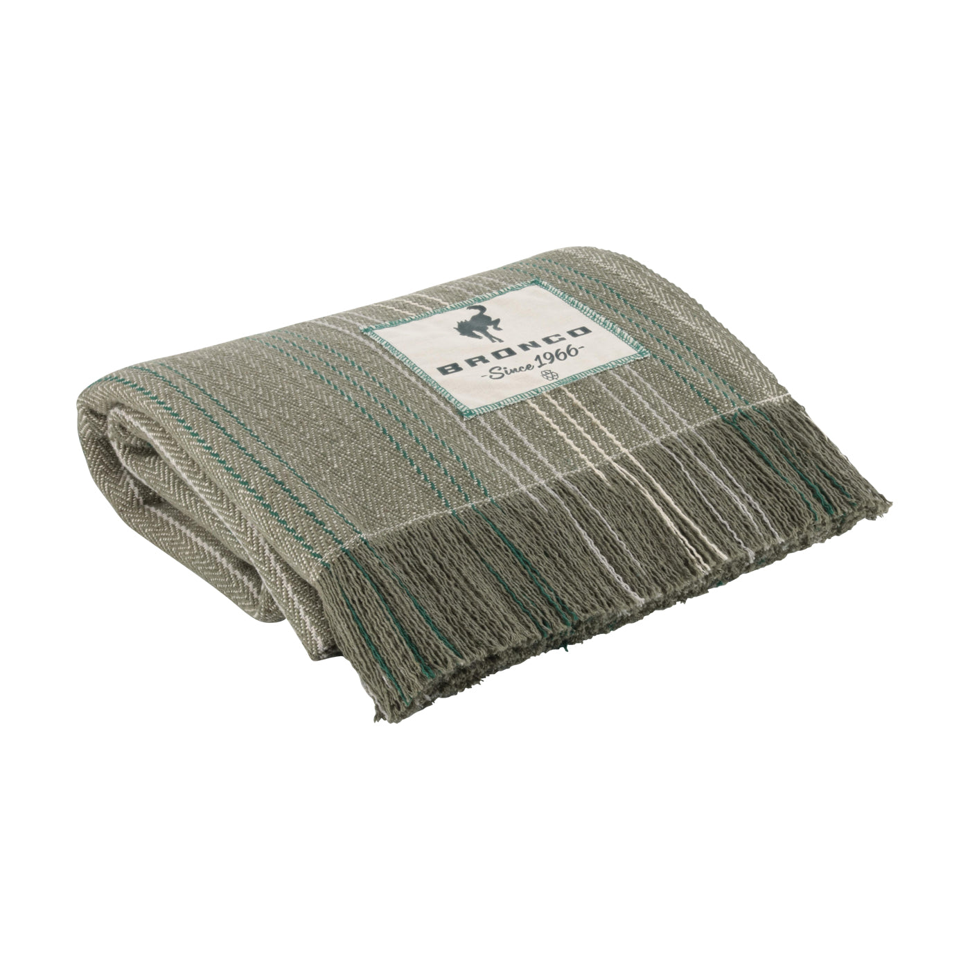 A folded woven throw blanket in a heathered gray and beige pattern with teal stripes and fringe, featuring a white brand label that reads 'andco Since 1966'.