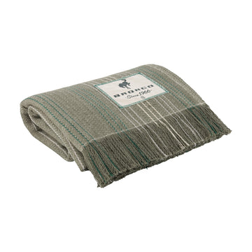 A folded woven throw blanket in a heathered gray and beige pattern with teal stripes and fringe, featuring a white brand label that reads 'andco Since 1966'.