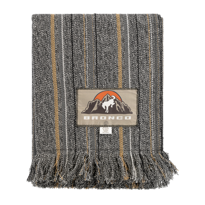 Striped blanket with a brand logo on a white background