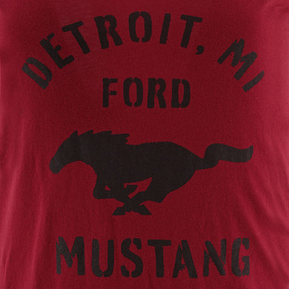 Red t-shirt with black text and horse graphic on a red background