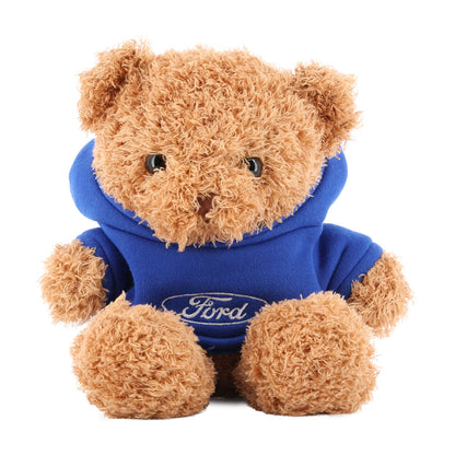 Teddy bear wearing a blue hoodie with Ford logo on a white background