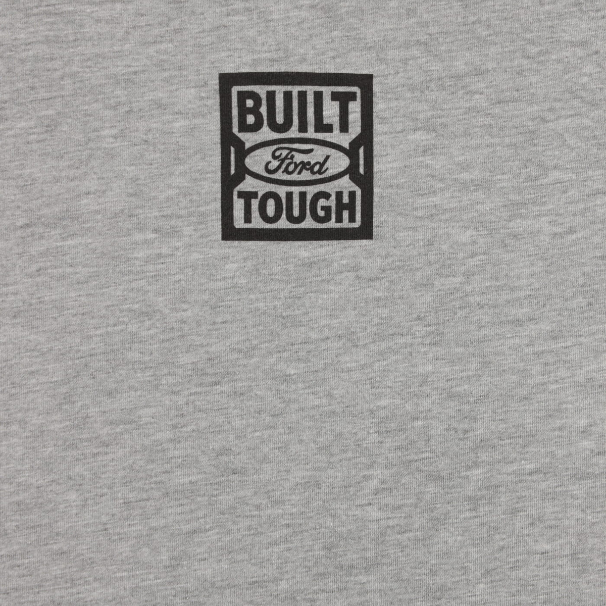 close up of a blue built ford tough logo on a gray background