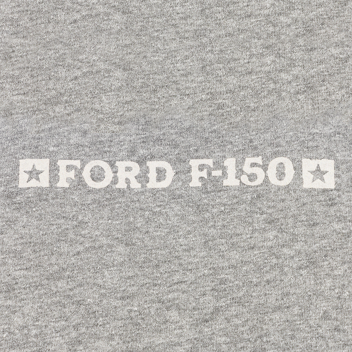 close up of Ford f-150 text on a gray background