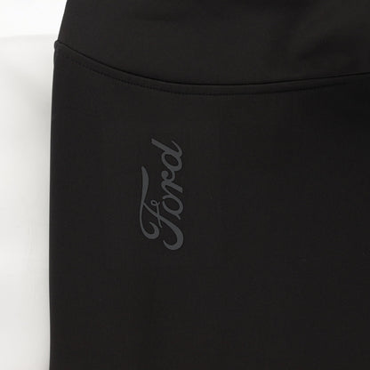 close up of ford script on sleeve on black background