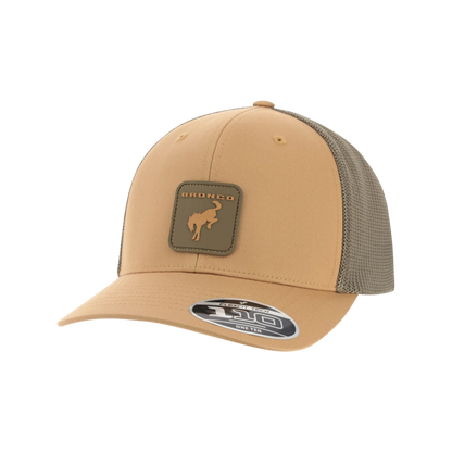 Tan and brown trucker cap with mesh back on a white background