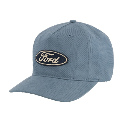 light blue chevron textured hat with navy blue oval and white ford script patch