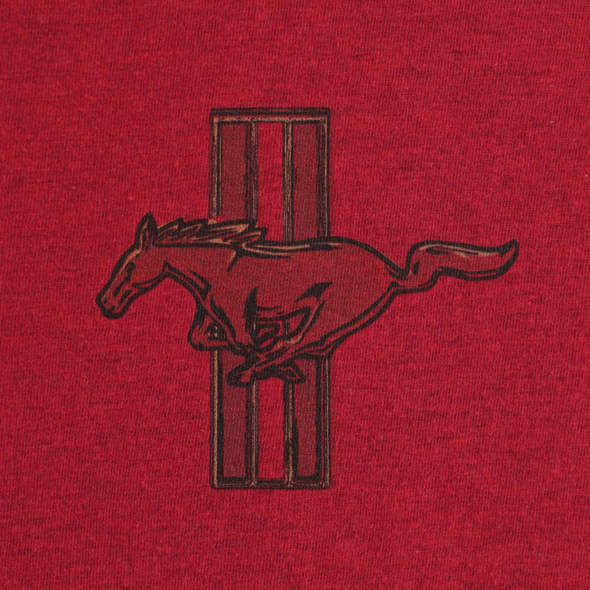 Embroidered horse design on a red fabric background