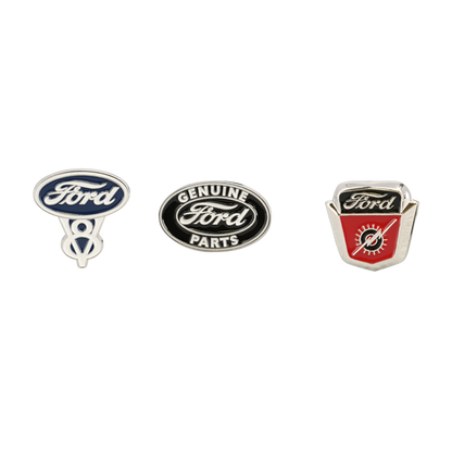 Three Ford logo pins on a white background