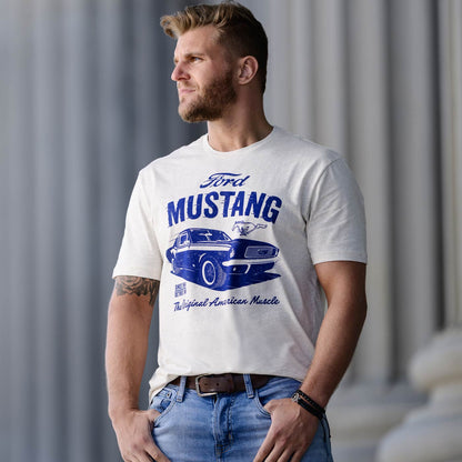 Man wearing a white t-shirt with Ford vintage Mustang graphic design.